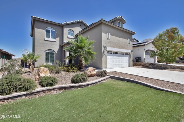 mediterranean / spanish-style house featuring concrete driveway, a front yard, an attached garage, and stucco siding