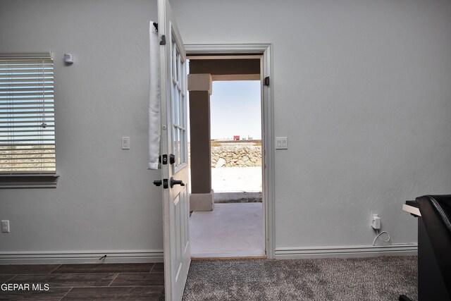 interior space featuring baseboards