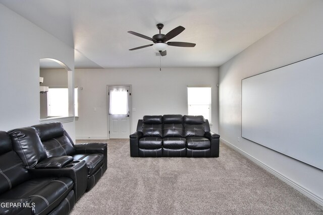 living room with carpet floors, plenty of natural light, and ceiling fan