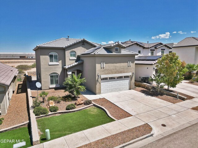 mediterranean / spanish house featuring a tile roof, stucco siding, concrete driveway, an attached garage, and a residential view