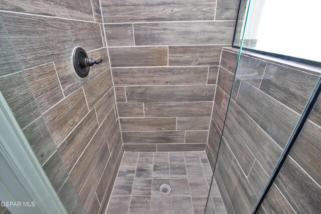 bathroom featuring a shower stall