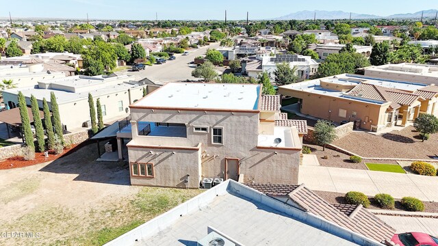 birds eye view of property featuring a mountain view