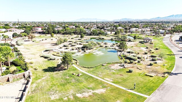 birds eye view of property featuring a water and mountain view