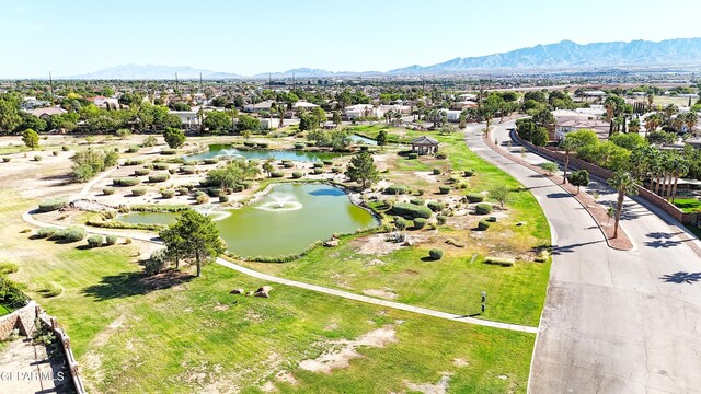 aerial view featuring a water and mountain view