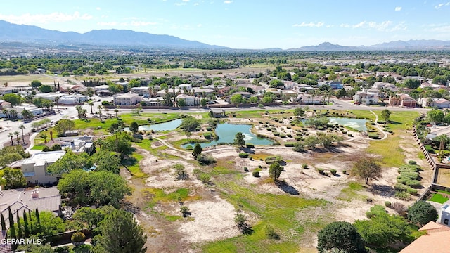 bird's eye view featuring a water and mountain view