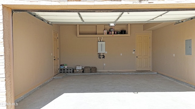 garage featuring tankless water heater and electric panel