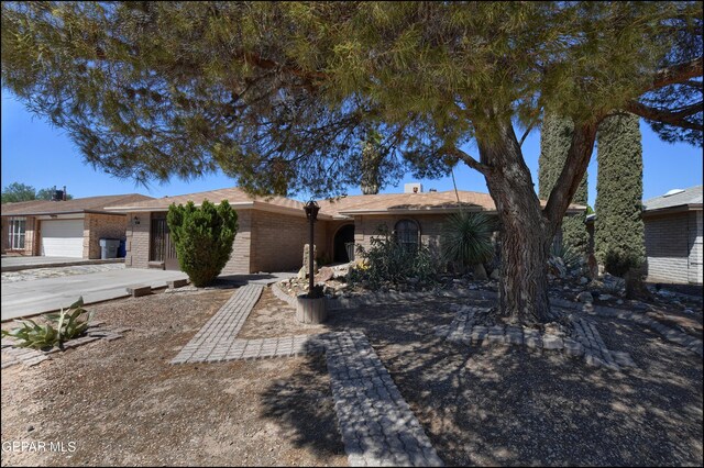 single story home with a garage