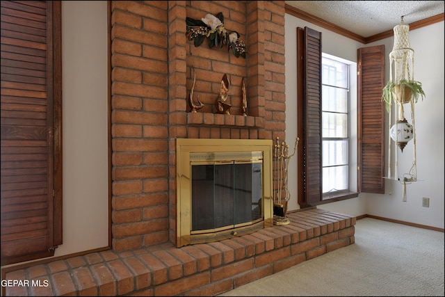 unfurnished living room featuring baseboards, ornamental molding, a textured ceiling, carpet flooring, and a fireplace