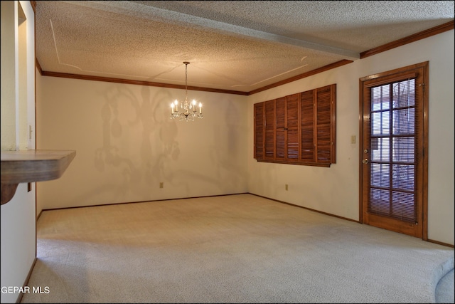 unfurnished dining area with ornamental molding, carpet, a chandelier, and a textured ceiling