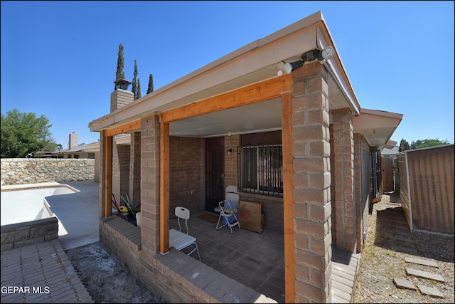 view of patio featuring fence