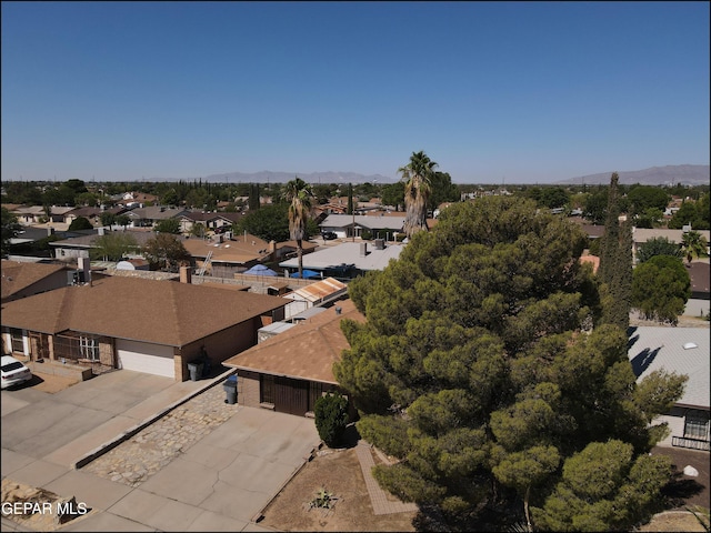 drone / aerial view with a residential view and a mountain view