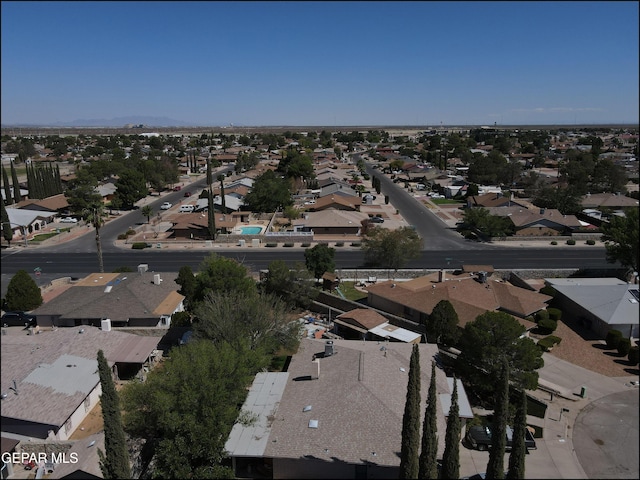 birds eye view of property with a residential view