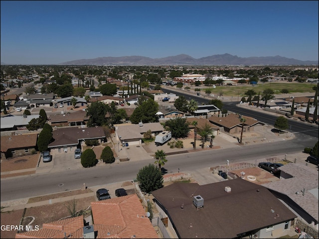 drone / aerial view featuring a residential view and a mountain view