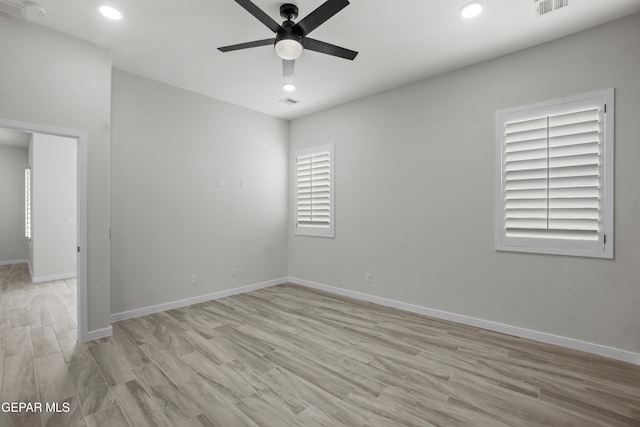 unfurnished room featuring ceiling fan and light hardwood / wood-style floors