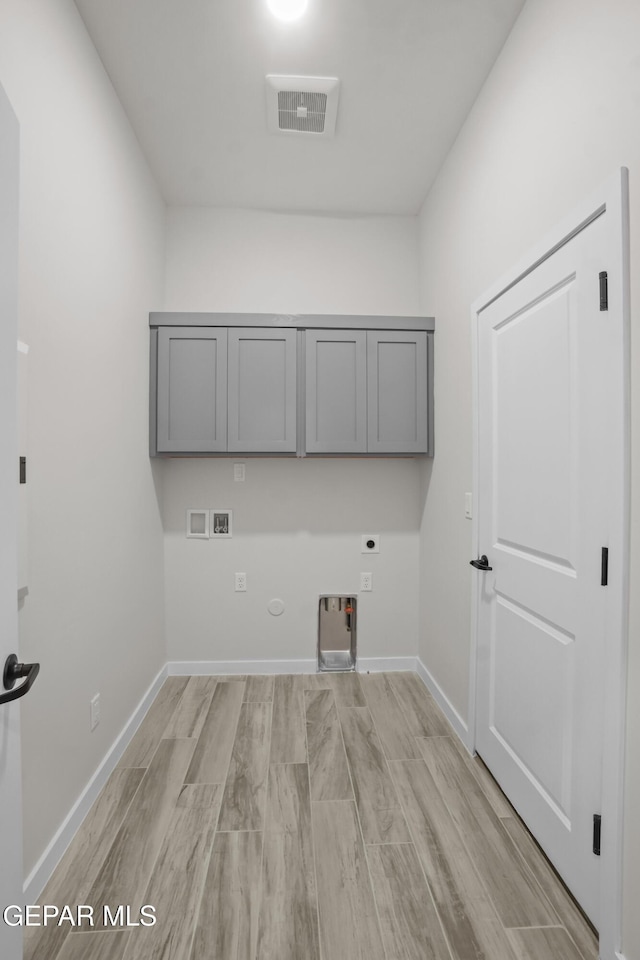 laundry room with washer hookup, cabinet space, visible vents, hookup for an electric dryer, and gas dryer hookup