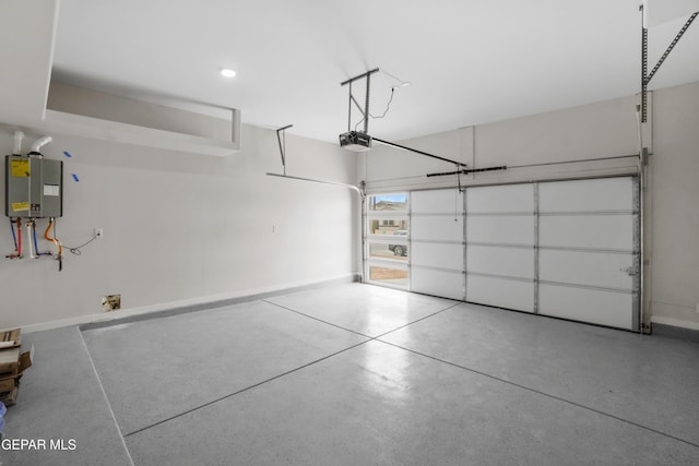 garage with baseboards, tankless water heater, and a garage door opener