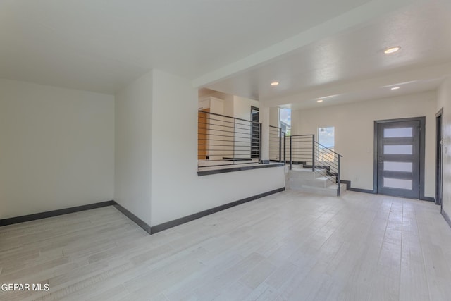 foyer with stairway, recessed lighting, baseboards, and light wood-type flooring