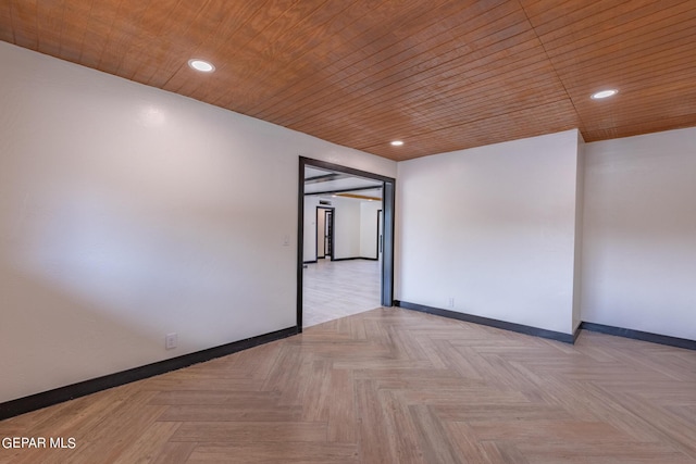 unfurnished room featuring recessed lighting, wooden ceiling, and baseboards