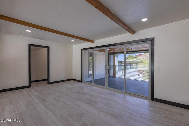 empty room with recessed lighting, beamed ceiling, baseboards, and light wood finished floors