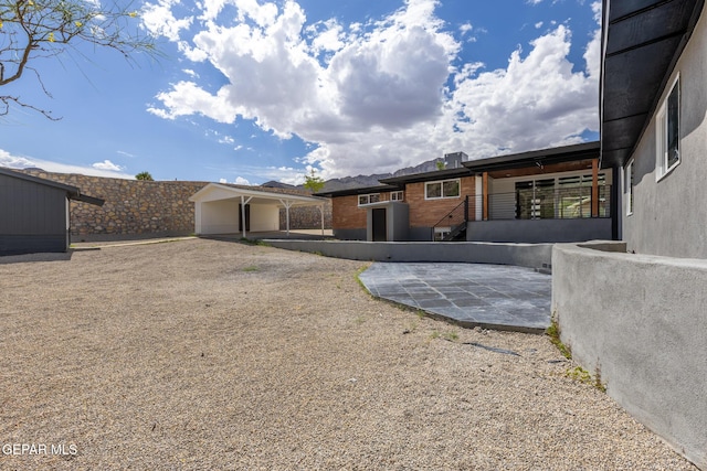 back of property featuring a patio area