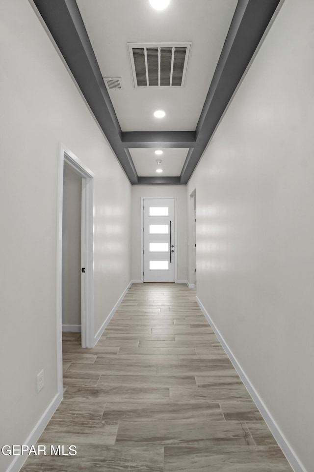 corridor featuring wood-type flooring