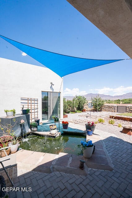 view of patio / terrace with a mountain view