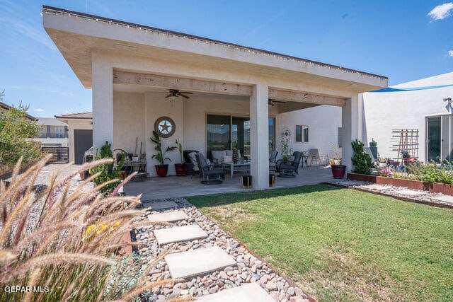 exterior space featuring ceiling fan, a yard, and a patio