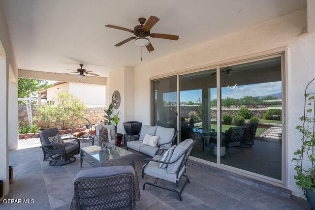 view of patio / terrace featuring ceiling fan and an outdoor hangout area