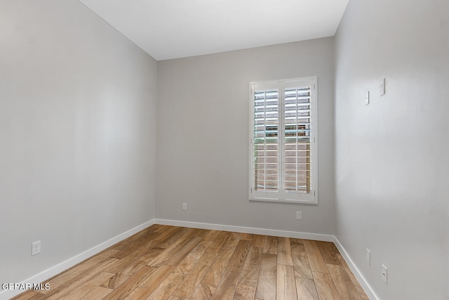 spare room featuring light hardwood / wood-style floors