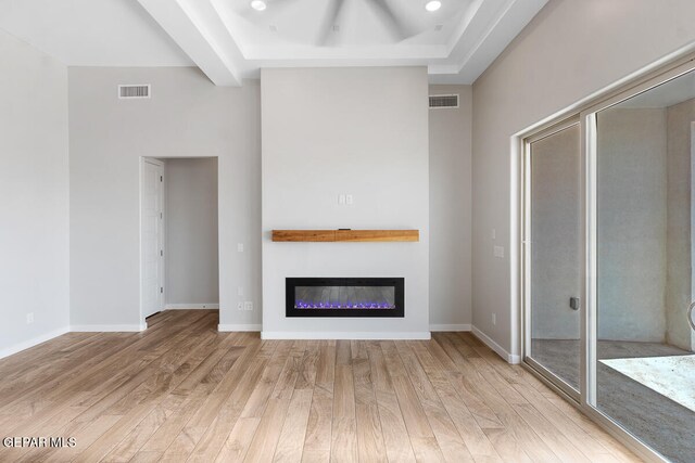 unfurnished living room with light hardwood / wood-style flooring