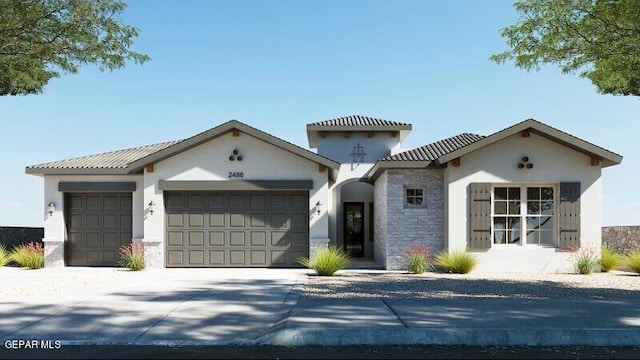 mediterranean / spanish home featuring a garage