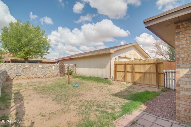 view of yard with a gate and fence