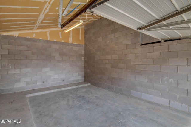 garage featuring concrete block wall