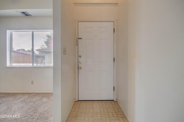 interior space with visible vents and baseboards