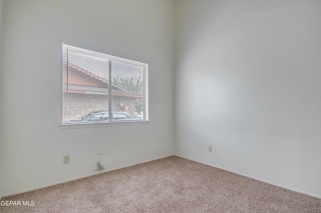 unfurnished room featuring carpet