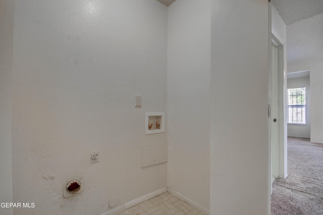 washroom with baseboards, laundry area, electric dryer hookup, washer hookup, and hookup for a gas dryer