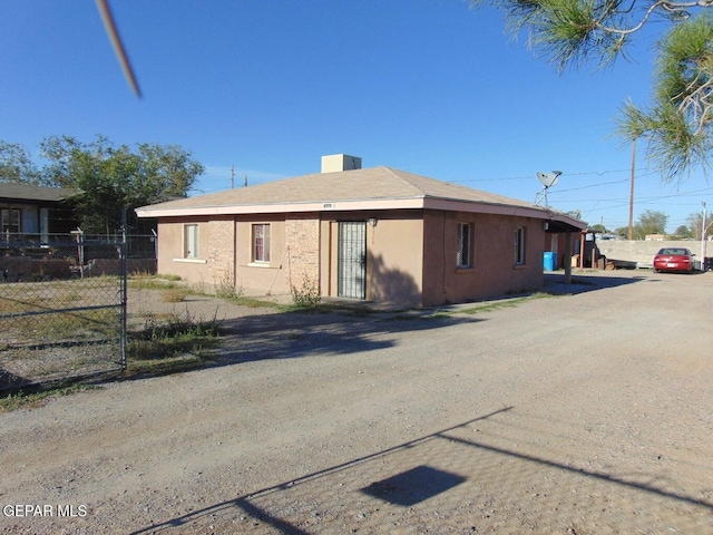 view of property exterior with fence