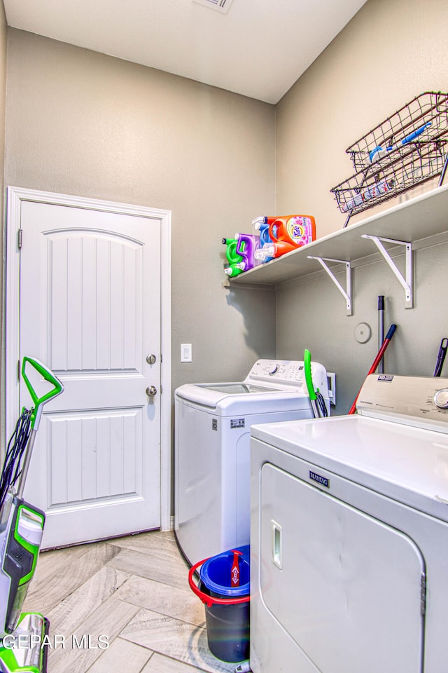 washroom featuring separate washer and dryer