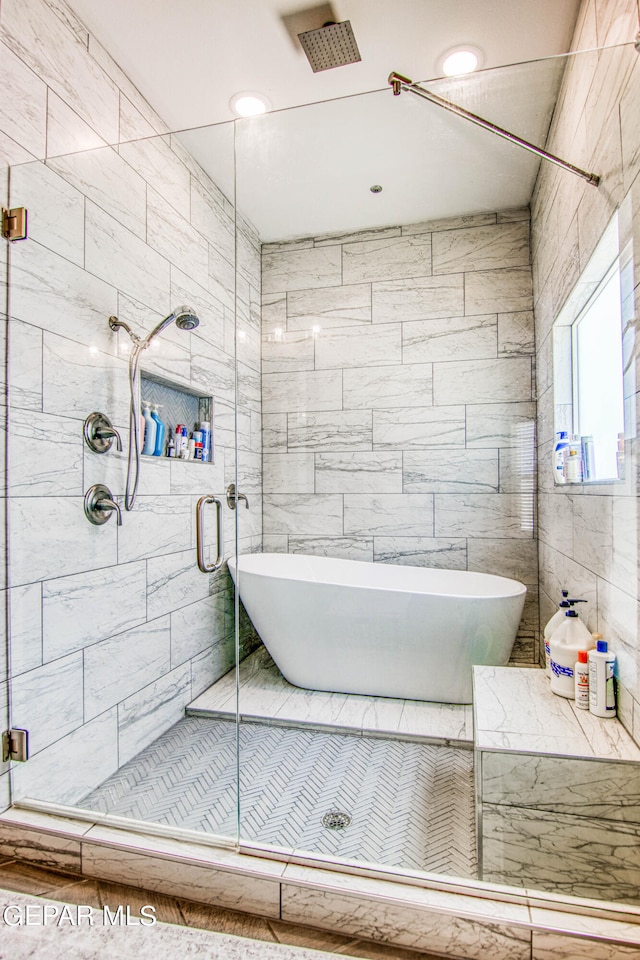 bathroom with independent shower and bath