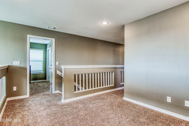 unfurnished room featuring carpet floors