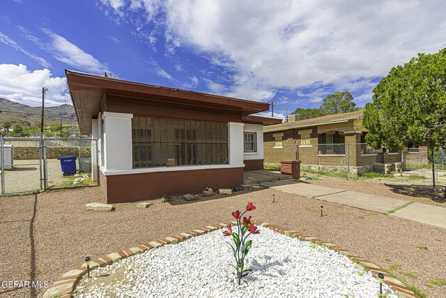 view of front of property with a sunroom