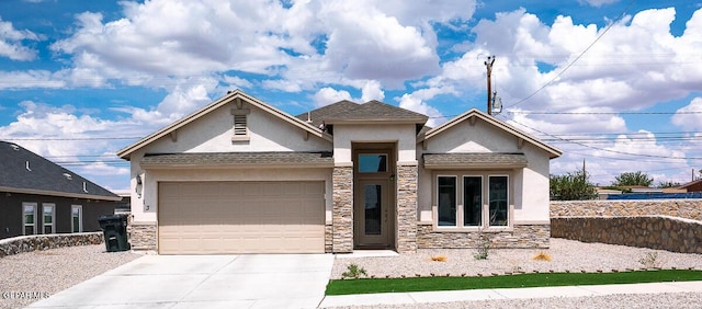 view of front facade with a garage, stone siding, driveway, and stucco siding