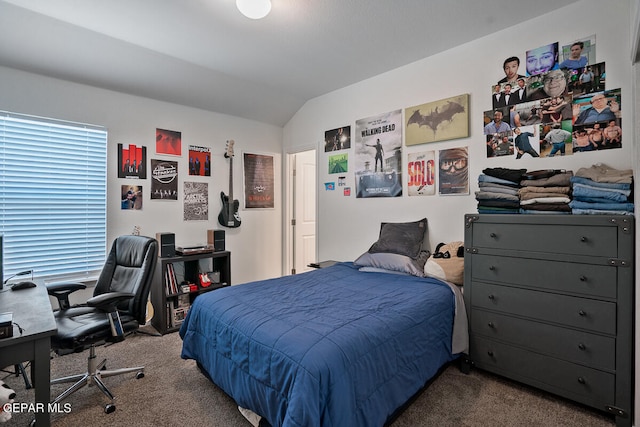 carpeted bedroom with vaulted ceiling