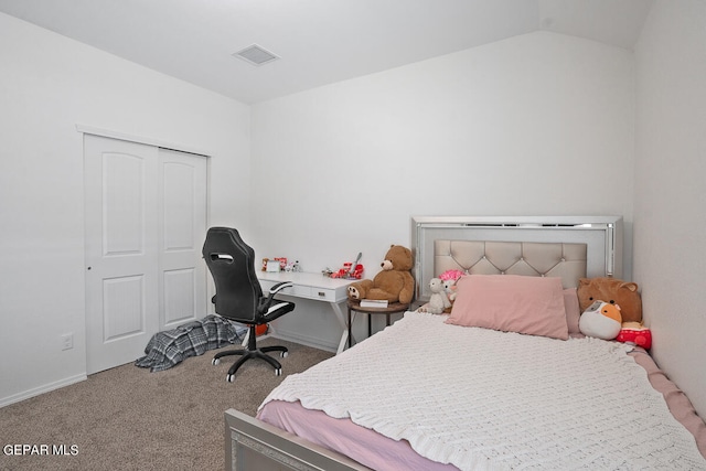 bedroom with carpet, vaulted ceiling, and a closet