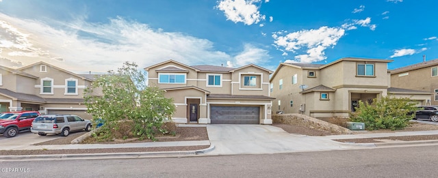 townhome / multi-family property featuring a garage