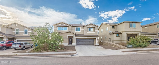 multi unit property featuring a residential view, concrete driveway, an attached garage, and stucco siding