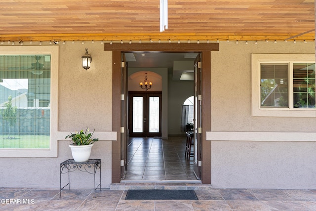 doorway to property with french doors and stucco siding