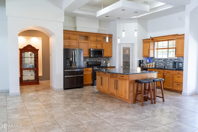 kitchen featuring arched walkways, open shelves, a high ceiling, a kitchen island, and black appliances