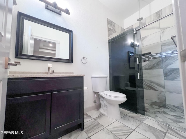 bathroom with toilet, vanity, baseboards, marble finish floor, and a stall shower