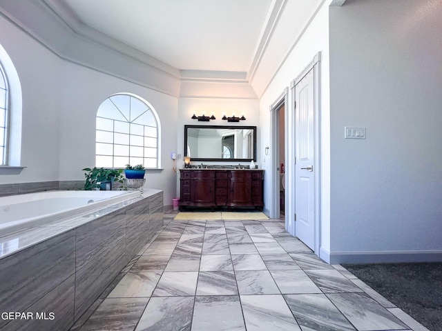 full bath with toilet, marble finish floor, a garden tub, and vanity